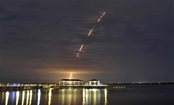 The launch of a Air Force and United Launch Alliance Delta IV rocket and Global Positioning Systems satellite from Cape Canaveral Air Force Station, Fla., is seen from the Eau Gallie Pier in Melbourne, Fla.